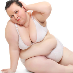 The Fat Lip Fat woman dressed in bra and underwear on a white background.