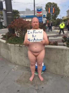 Shane Brodie, fat trans artist, naked protest against Donald Trump statue installation by INDECLINE